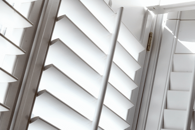 Louvres on a set of classic plantation shutters are featured in a close-up